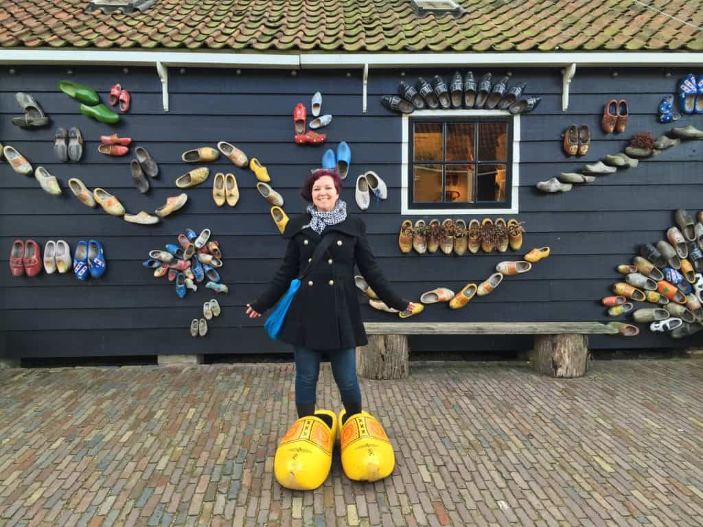 Cate in the Netherlands with large wooden shoes